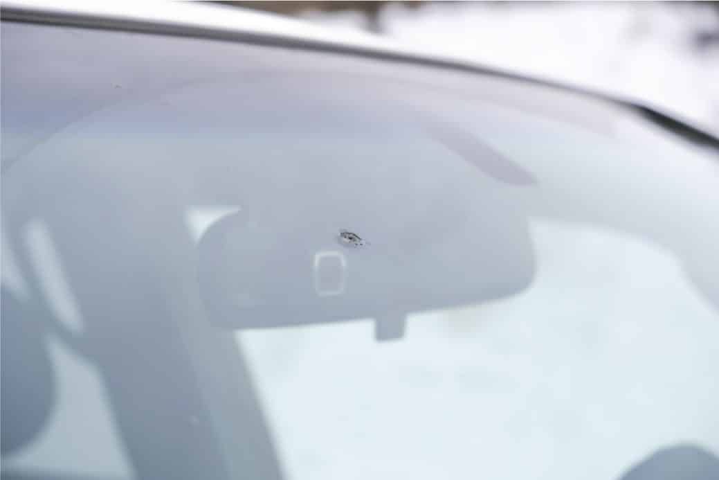 part of slider image showing a chip removed on a USA windshield by TintBusiness